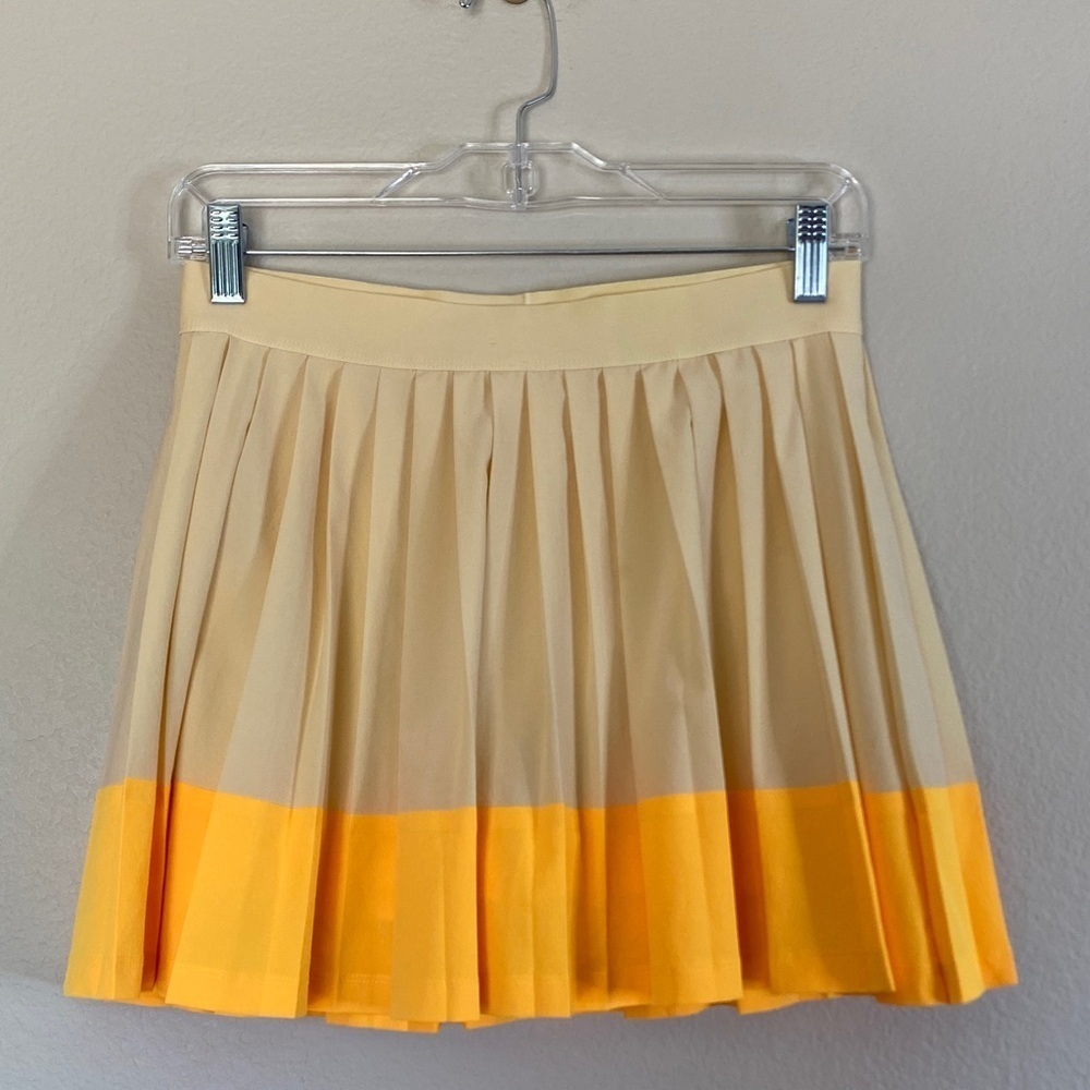 Athleta girl pleated tennis skirt kids XXL 16 orange yellow EUC skort